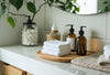 Reusable makeup remover pads stacked on a bamboo tray in a fresh, eco-friendly bathroom setting